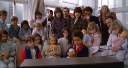 The children at the hospital watch the race on TV