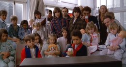 The children at the hospital watch the race on TV