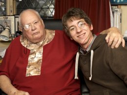 Sir Patrick Moore & Ciaran Brown each wearing a monocle