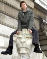 Ciaran Brown on 'Oscar' the right hand lion outside Nottingham's Council House