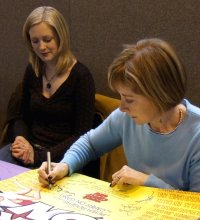 Angela Douglas signing the Carry On poster