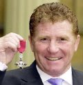 Alan Ball with his MBE in 2000
