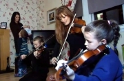 Nicola Benedetti visits young violinsts at their home as part of the 'Big Noise' project