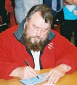 Brian Blessed signing autograph book