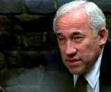 Simon Callow as St John in 'Surveillance'