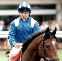 Willie Carson on Nashwan after winning the 1989 Epsom Derby