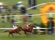 Willie Carson winning the 1988 St Leger on his homebred horse Minster Son, with the favourite Diminuendo in second place