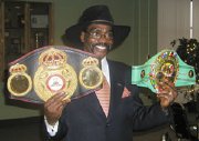 Rubin 'Hurricane' Carter with his WBC and WBA prize belts