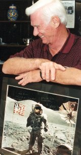 Gene Cernan with a signed picture of him on the moon