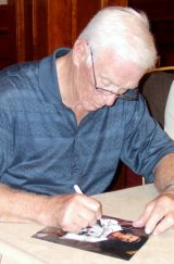 Gene Cernan signing photograph