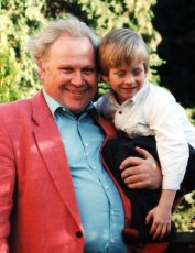 Five year old Ciaran Brown with Colin Baker