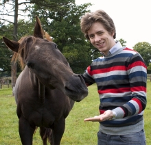 Ciaran Brown feeding a Polo mint to 31-year-old Golden Minstrel - Josh Gifford's first winner at Cheltenham