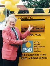 Colin Baker opens the FSID clothing bank in 1996