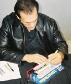 Robert Davi signing model of Kenworth tanker