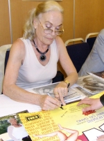 Shirley Eaton signing Carry On poster