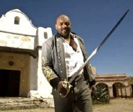 Ken Foree as the Barman in the film short 'Dead Bones' (2008)