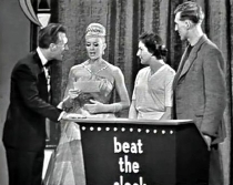 Bruce Forsyth with contestants in 'Beat the Clock'