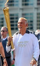 Bruce Forsyth proudly carries the Olympic Torch in 2012