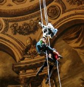 Jonathan Foyle, Lucy Creamer and the cameraman abseil down from the dome of St Paul's Cathedral in 'Climbing Great Buildings'