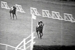 Josh Gifford on Honey End chases eventual winner Foinavon to the last fence in the 1967 Grand National