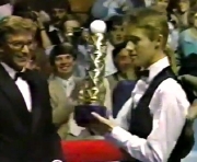Stephen Hendry receives the 'Rothman's Grand Prix' trophy after defeating Dennis Taylor in the final in 1987