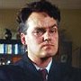 Charlie Higson as 'Geoffrey Norman MP'