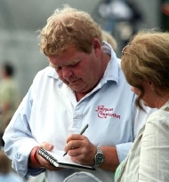 Geoffrey Hughes signs an autograph for a fan at the Fairport Copredy Convention