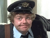 Geoffrey Hughes as The Postman in 'Confessions of a Driving Instructor' (1976)