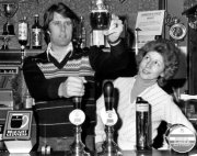 Geoff Hurst pulling a pint with his wife Judith