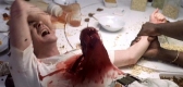 Alien bursting from John Hurt's stomach in the film 'Alien'