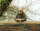 Jethro standing on a bridge and reflecting on his happy life in Devon