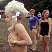 Anna Karan looks on as Barbara Windsor loses her bra in 'Carry On Camping'