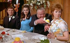 Anna Karen about to get food tipped down her front in 'Carry On Loving'!