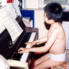 Young Lang Lang practising the piano