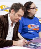 Mark Lester signing photograph at the NEC in Birmingham