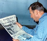 Jim Lovell reading about the safe return of Apollo 13