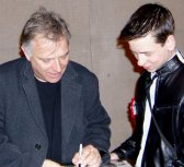 Rik Mayall signing photograph