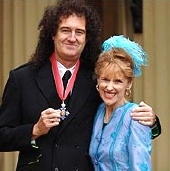 Brian May CBE, with his wife Anita Dobson at Buckingham Palace in 2005