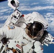 Bruce McCandless wearing his 'Manned Manoeuvring Unit' (MMU) for his untethered space walk