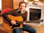 Ben Miller relaxes at home with his guitar