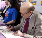 Ron Moody drawing a Fagin cartoon for Ciaran Brown