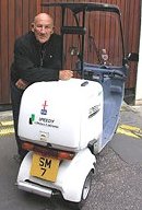 Sir Stirling Moss with his scooter and SM7 number plate