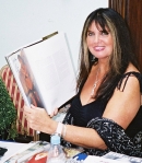 Caroline Munro with Ciaran Brown's Bond Girls book