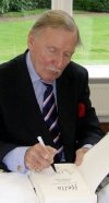 Leslie Phillips signing his autobiography at Pinewood