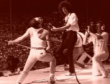 Freddie Mercury & Brian May perform at the 'Live Aid' concert at Wembley in July 1985