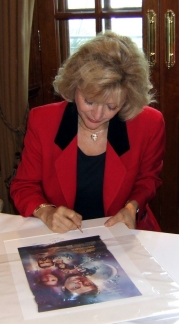 Blanche Ravalec signing the Moonraker lithograph