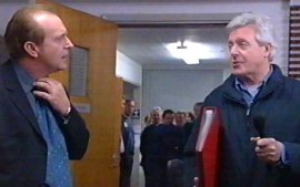 Simon Rouse is surprised by 'This Is Your Life' host Michael Aspel on the set of 'The Bill'