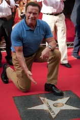 Arnold Schwarzenegger with his star on the 'Hollywood Walk of Fame'