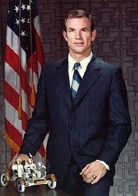 NASA photo of Dave Scott with model of the Lunar Rover