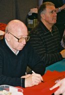 Nobby Stiles (Sir Geoff Hurst in background) signing football shirt